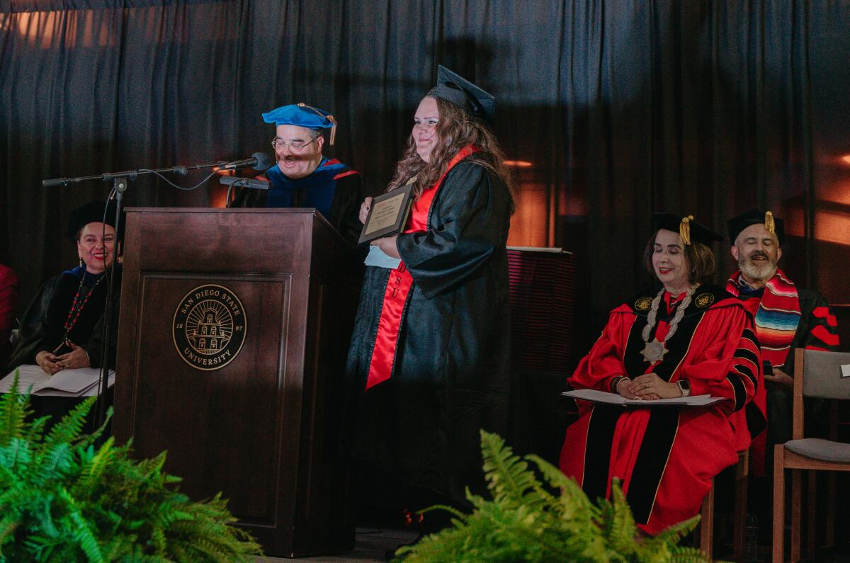 Andrea Van Bebber receives her diploma.