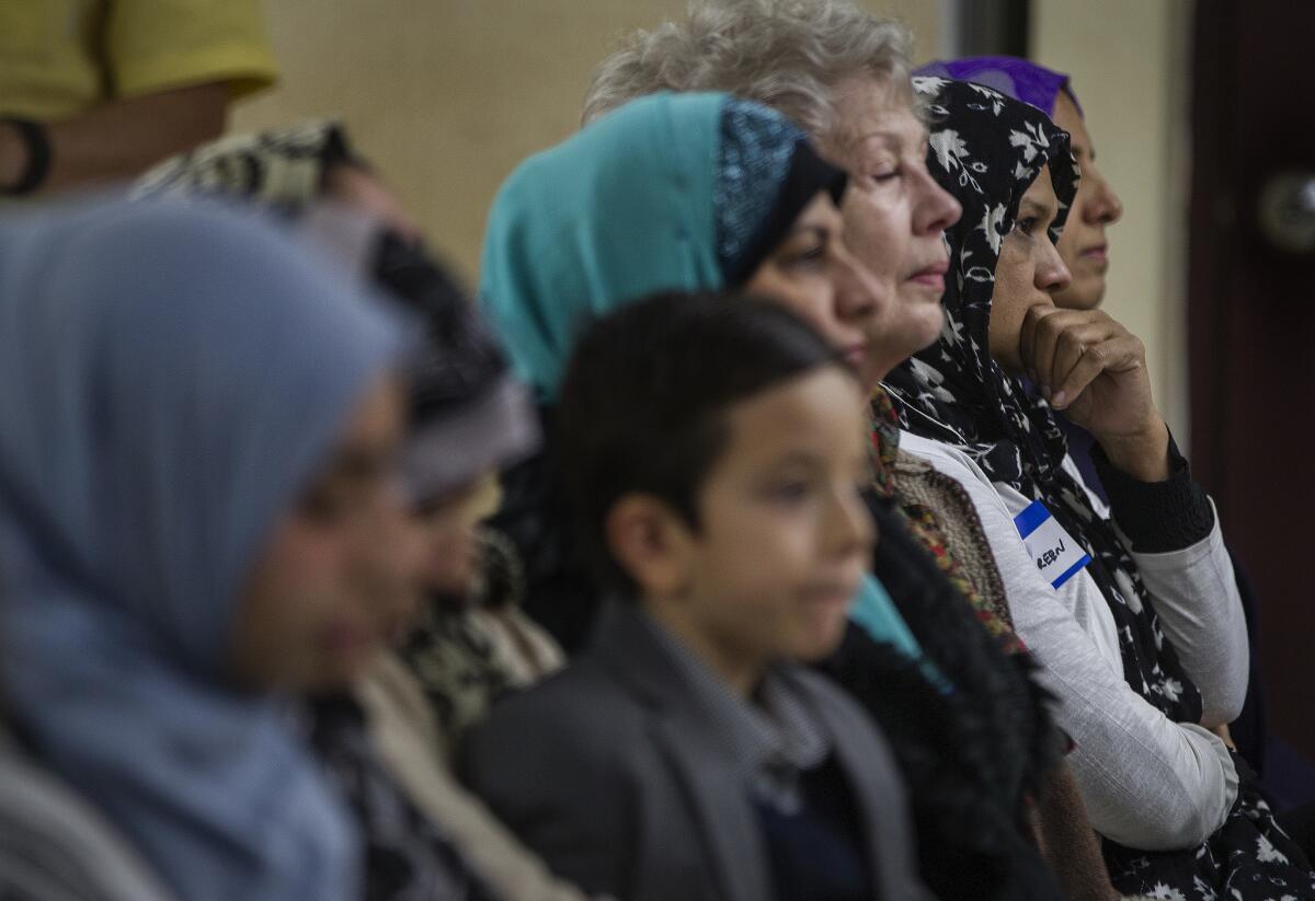 Community members attend an interfaith prayer service Saturday at the Islamic Center of Inland Empire for the victims of the San Bernardino shooting rampage.