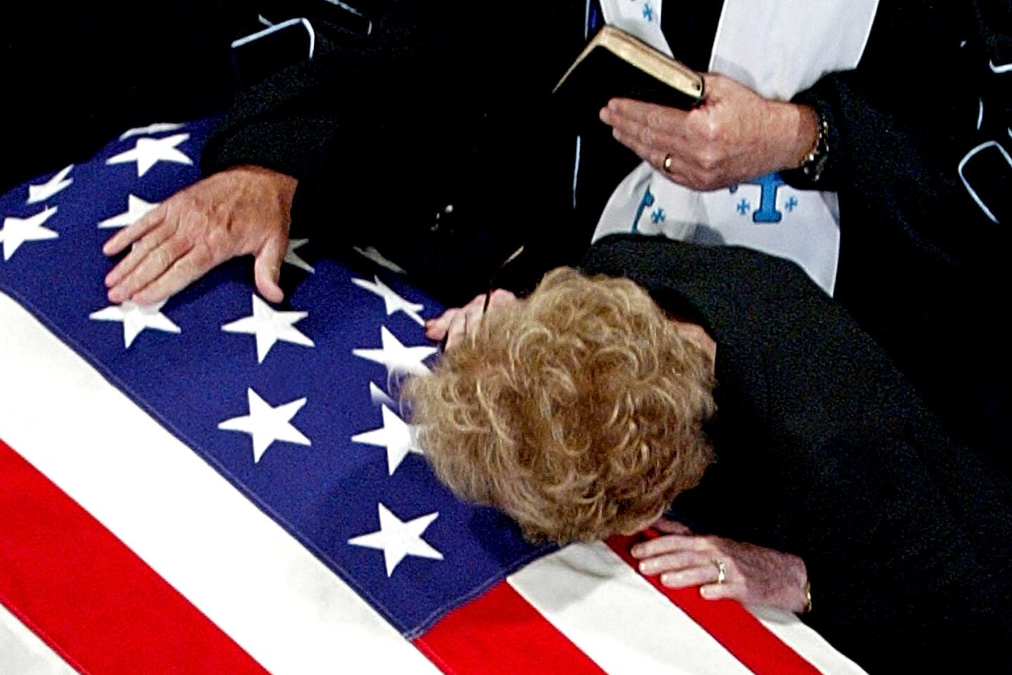 The former first lady lays her cheek on Ronald Reagan's casket after his death in 2004. His Alzheimer's diagnosis led her to become an advocate for stem cell research and hastened a reconciliation between her and her children.