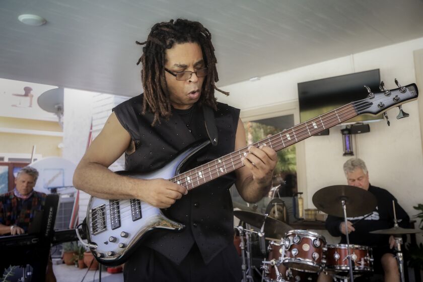 SAN DIEGO, CA - OCTOBER 22: Bassist Cecil McBee Jr. rehearses with friends Adam Wolff (left, keyboards) and Barry Farrar (right, drums) at Farrar's home in Tierra Santa on Thursday, Oct. 22, 2020 in San Diego, CA. (Eduardo Contreras / The San Diego Union-Tribune)