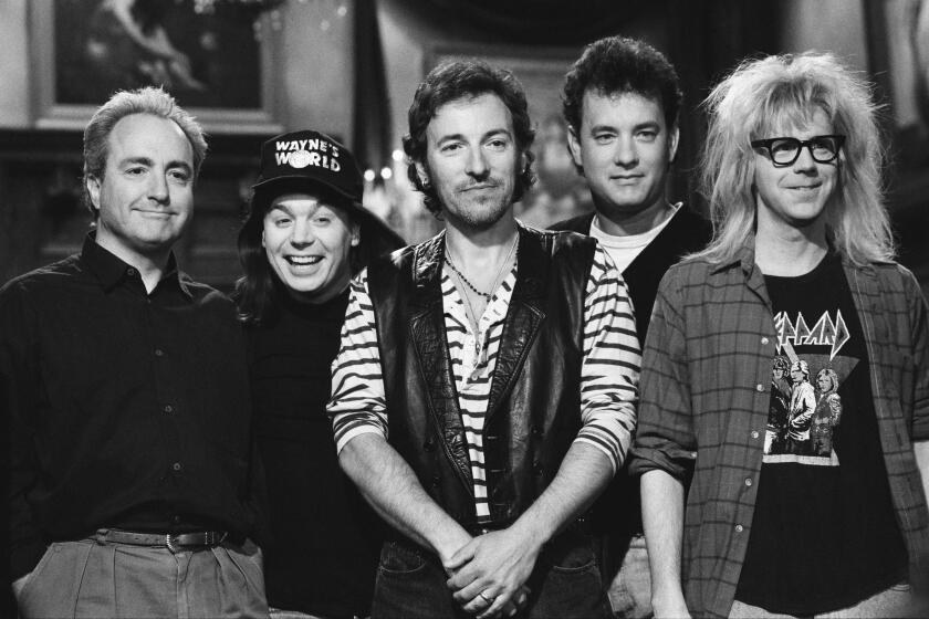 SATURDAY NIGHT LIVE -- Episode 19 -- Pictured: (l-r) Lorne Michaels, Mike Myers as Wayne Campbell, Bruce Springsteen, Tom Hanks, Dana Carvey as Garth Algar on May 9, 2010 -- Photo by: Alan Singer/NBCU Photo Bank