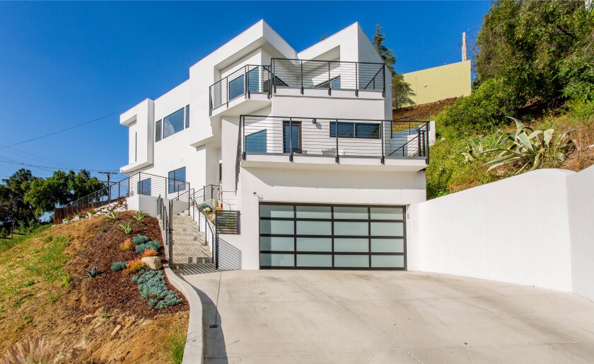 Built in 2014, the two-story stucco home takes advantage of the scenic view with picture windows and a pair of decks.