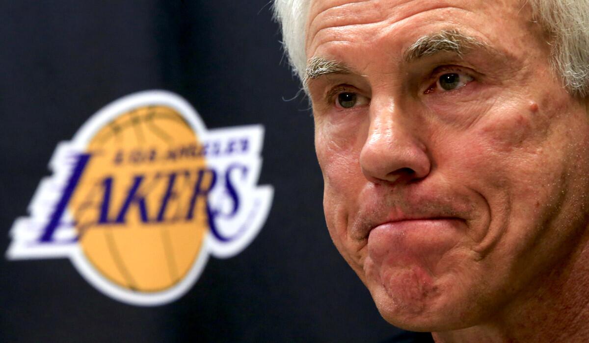 Lakers General Manager Mitch Kupchak listens to a question from a reporter during a news conference in El Segundo on Friday.