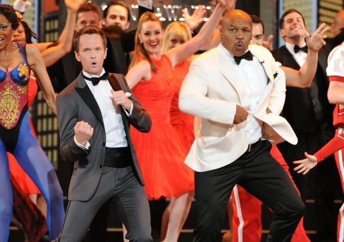 Host Neil Patrick Harris and casts of Broadway shows perform during the opening number.