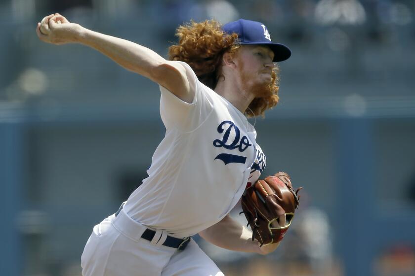 Los Angeles Dodgers starting pitcher Dustin May throws to a St. Louis Cardinals batter during the first inning of a baseball game in Los Angeles, Wednesday, Aug. 7, 2019. (AP Photo/Alex Gallardo)