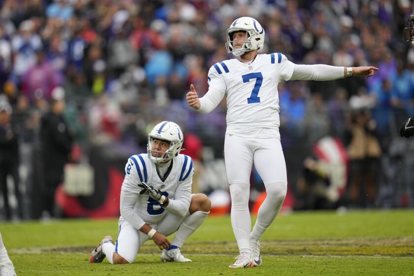 Indianapolis Colts place kicker Matt Gay (7) watches his field goal out of the hold of Rigoberto Sanchez during the second half of an NFL football game against the Baltimore Ravens, Sunday, Sept. 24, 2023, in Baltimore. (AP Photo/Julio Cortez)