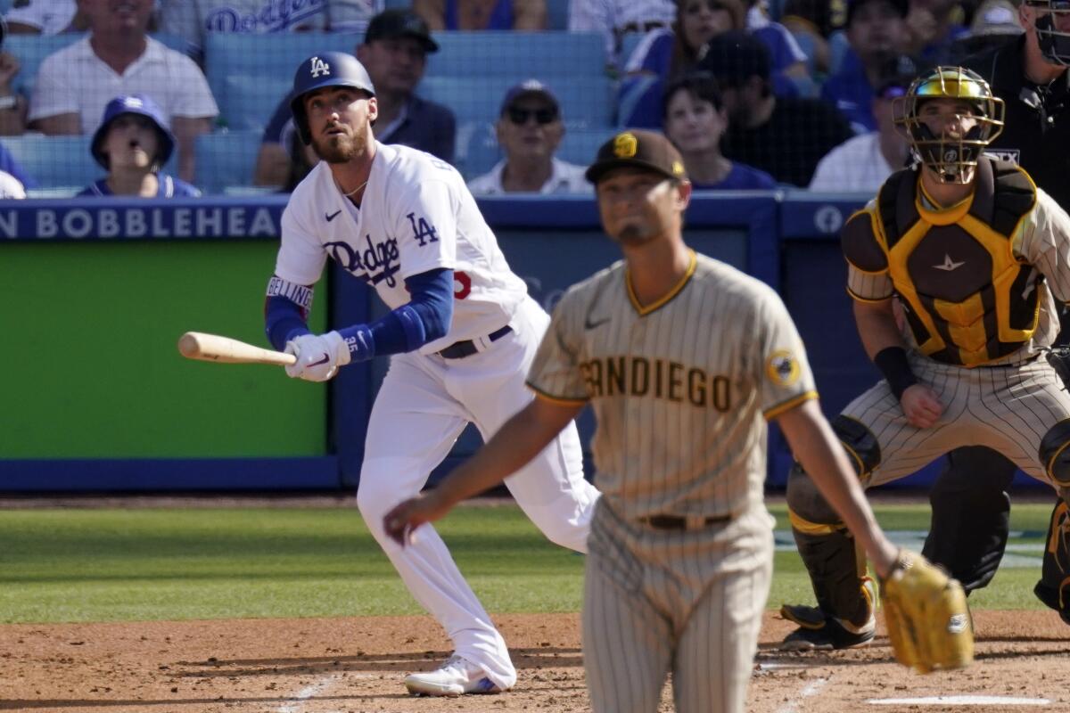 Dodgers center fielder Cody Bellinger hits a home run against Padres pitcher Yu Darvish.