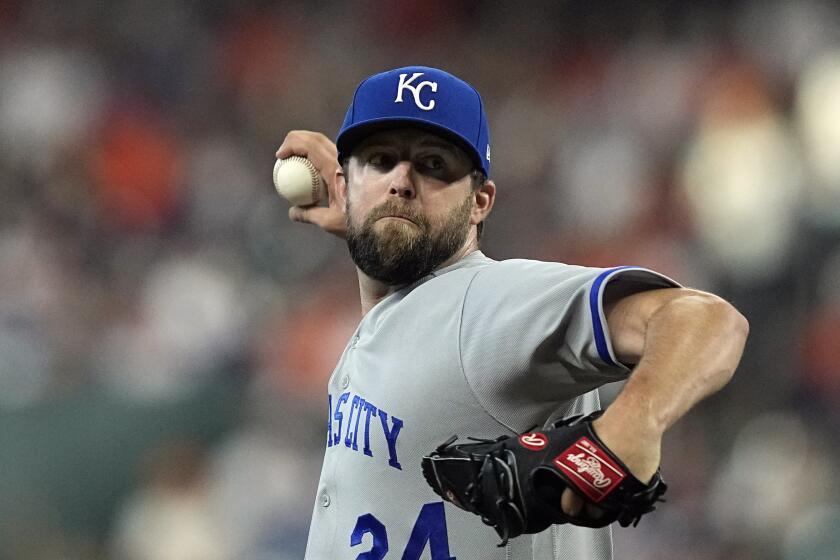 Kansas City Royals starting pitcher Jordan Lyles throws against the Houston Astros during the first inning of a baseball game Saturday, Sept. 23, 2023, in Houston. (AP Photo/David J. Phillip)