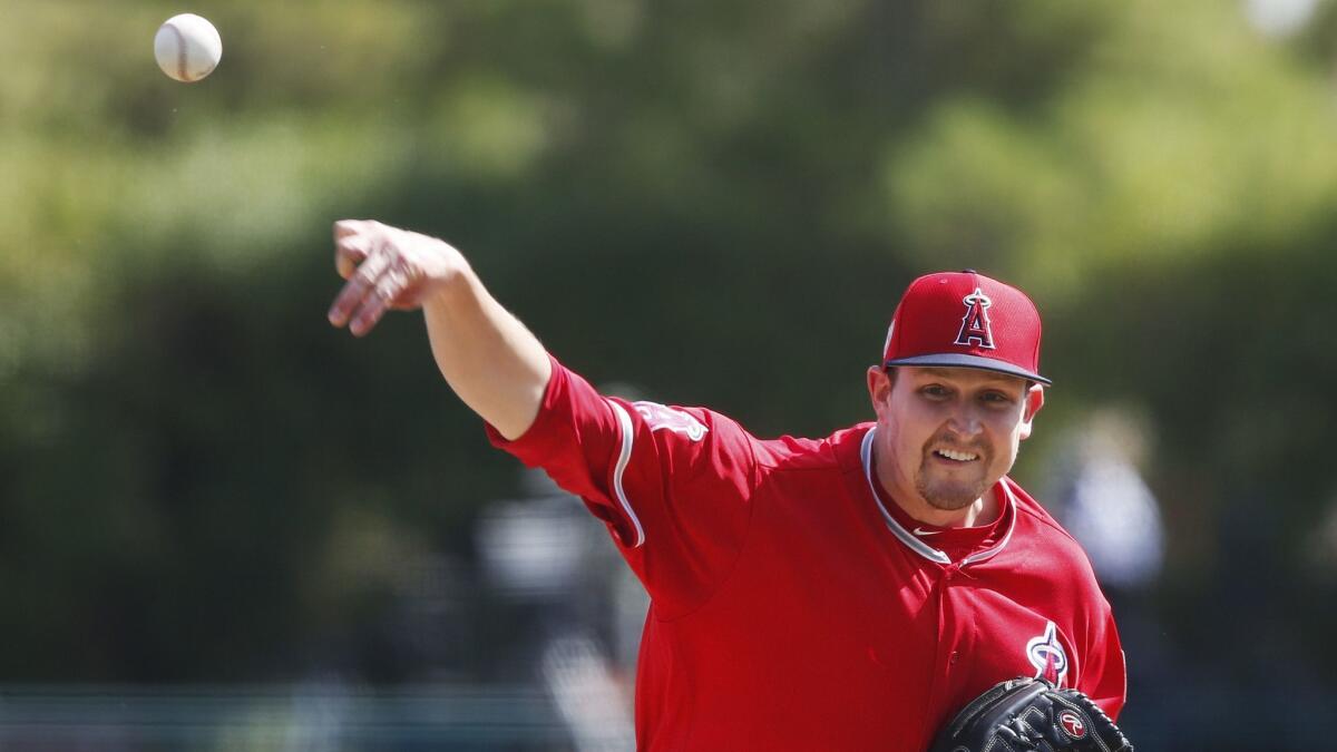 Angeles starting pitcher Trevor Cahill pitches in the first inning of an exhibition game against the Chicago White Sox on March 4.