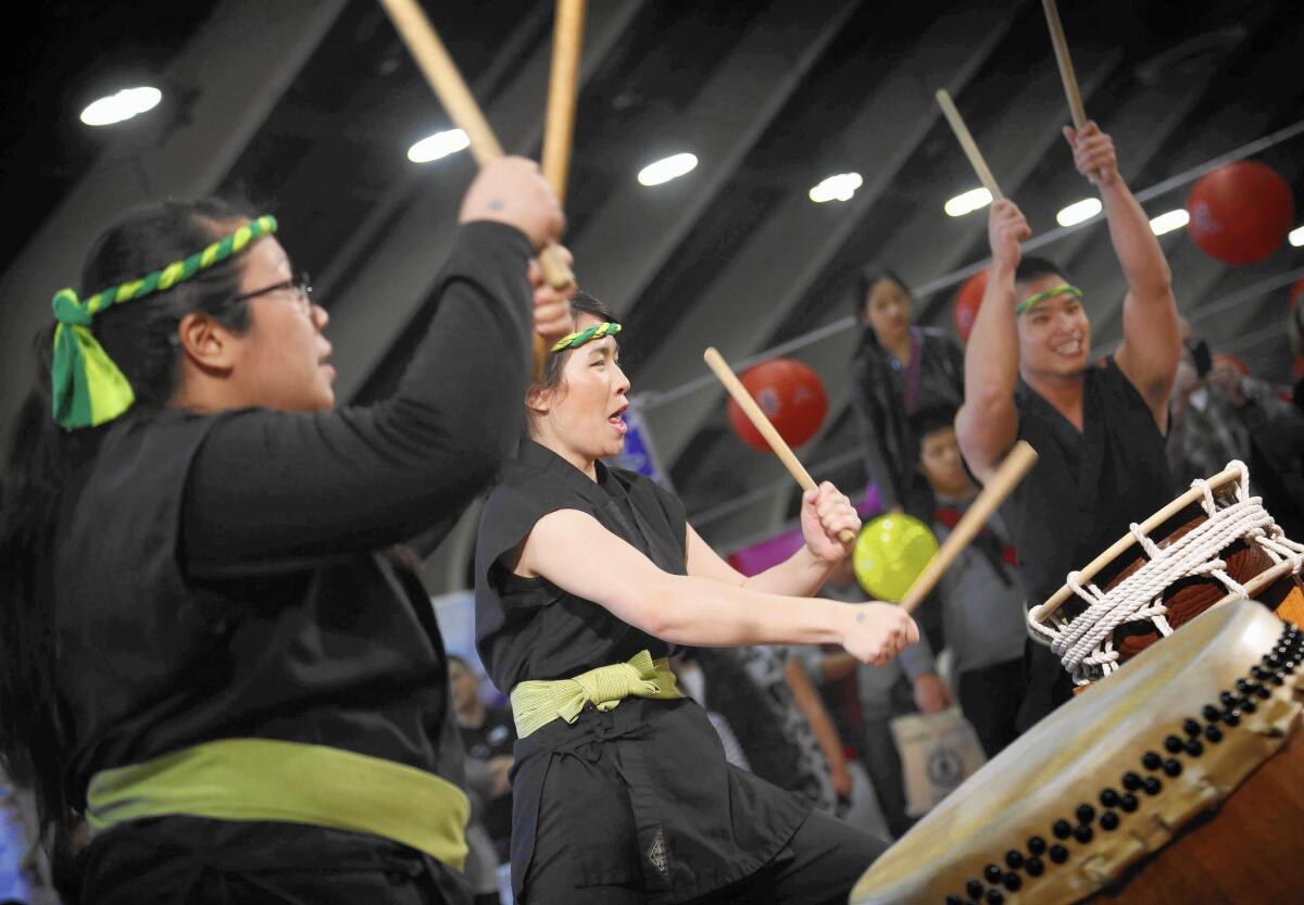 The group TaikoMix performs on Japanese drums at the Asian American Expo in Pomona on Sunday.