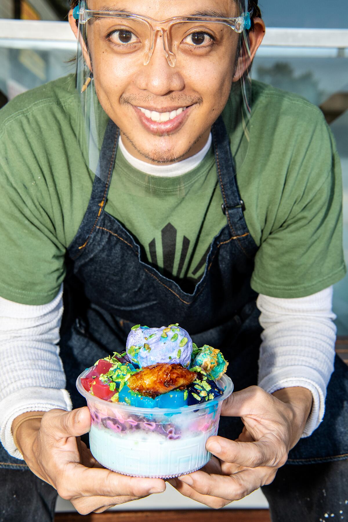 Christian Esteban holds the halo halo from his family's store, Chaaste Family Market in Pasadena.