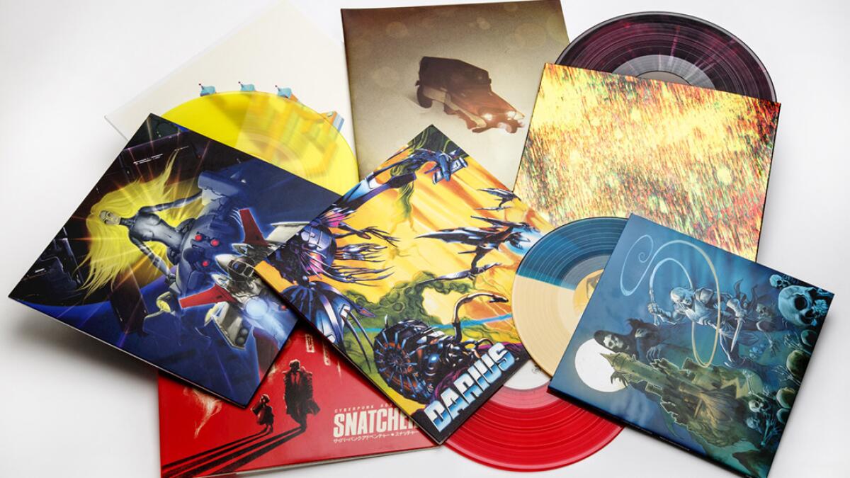 A selection of vinyl records of video game scores on multicolored vinyl, with deluxe packaging and detailed liner notes.