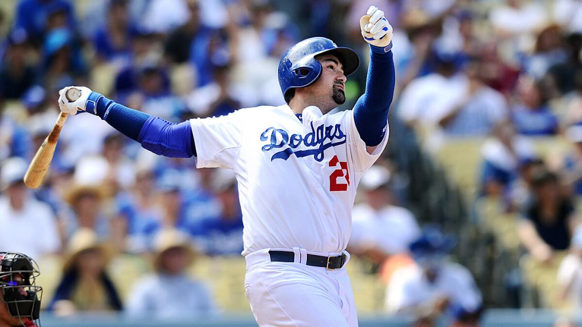 Dodgers first baseman Adrian Gonzalez hits a three-run home run in the sixth inning of a 7-2 win over the Arizona Diamondbacks on Sunday.
