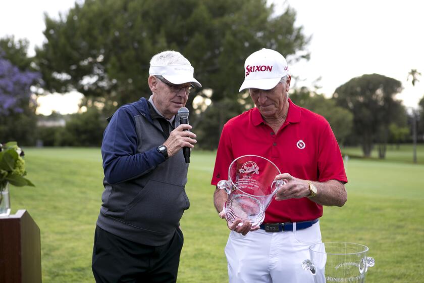 Gordon Bowley gives a special award to Mesa Verde's Tom Sargent during the 18th annual Jones Cup at Mesa Verde Country Club on Thursday, May 25.