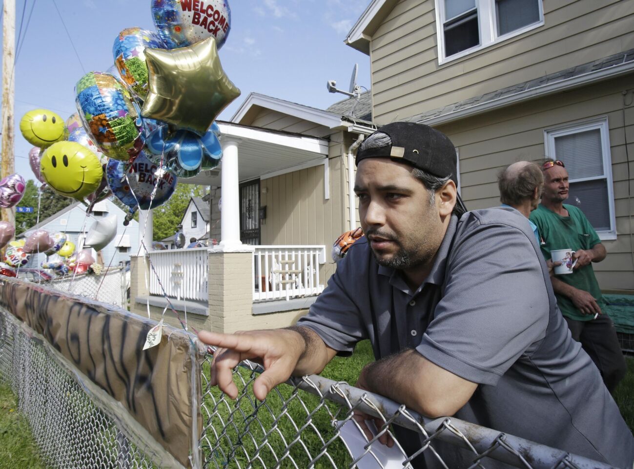 Ricardo DeJesus talks about his sister Gina at the family's home in Cleveland. Police said Gina DeJesus and two other women who went missing separately about a decade ago were found Monday.