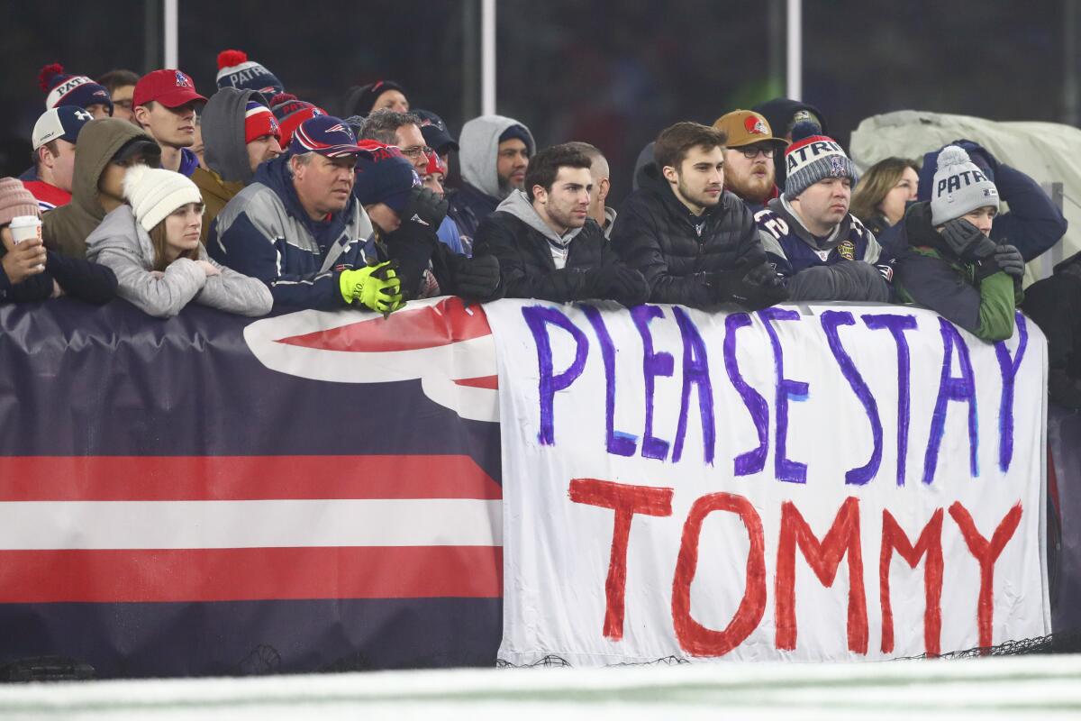 Patriots fans show their support for Tom Brady during New England's playoff loss to the Tennessee Titans in January.