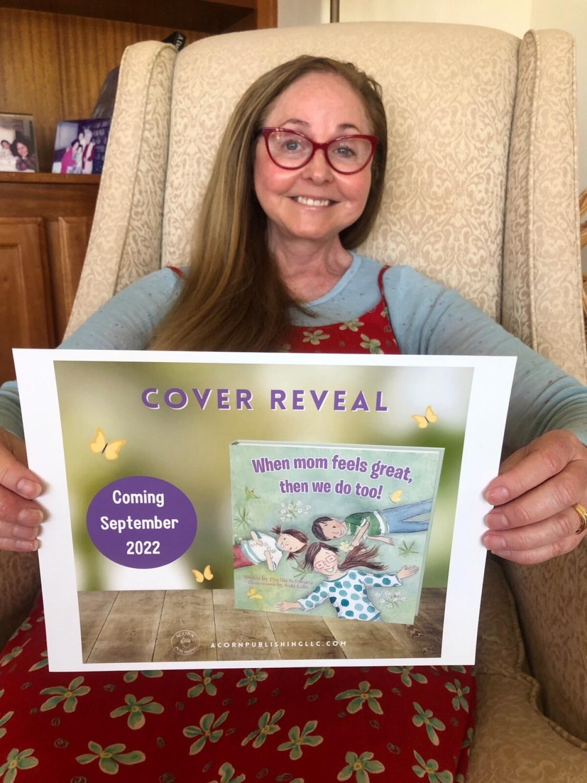 Phyllis Schwartz displays the cover of her children’s book, which will be released Sept. 23 by Acorn Publishing.