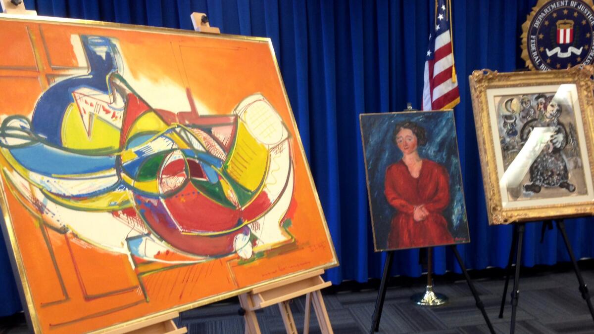 Several paintings recovered from the 2008 heist are displayed before a Dec. 19 FBI news conference in Los Angeles. Three paintings are still missing.