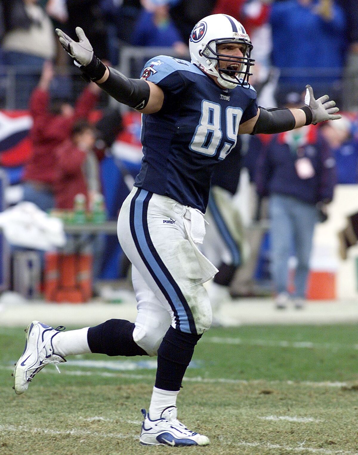 Titans tight end Frank Wycheck celebrates after throwing a lateral to Kevin Dyson on a kickoff return for a touchdown in the AFC wild-card game against the Bills on Jan. 8, 2000.