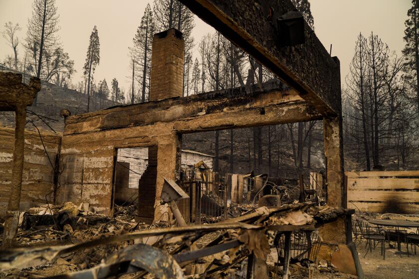 The smoldering remains of Cressman’s General Store and Gas Station along CA-168, where the Creek fire tore through.