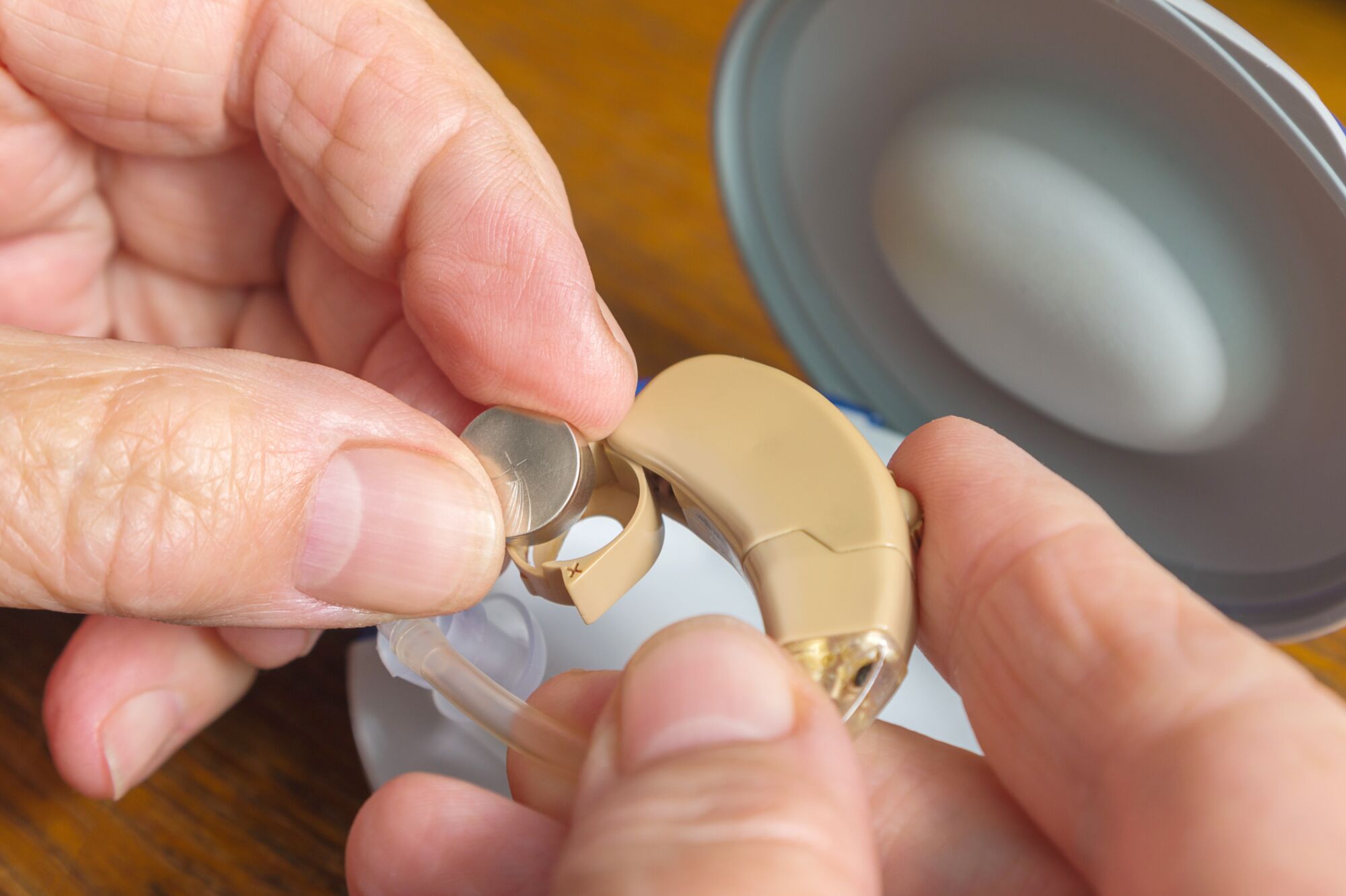 Learning to change hearing aid batteries and filters is an important skill for family caregivers.