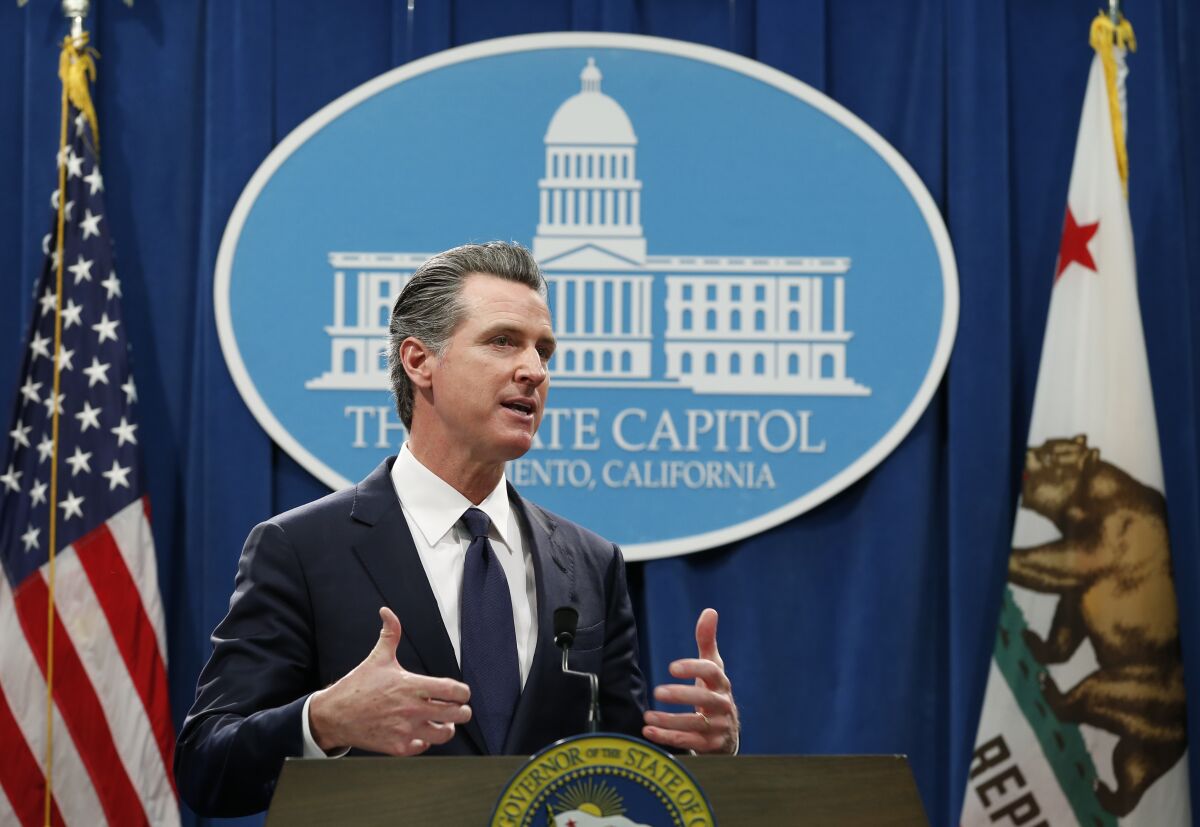 California Gov. Gavin Newsom discusses his proposed 2020-2021 state budget during a news conference in Sacramento on Friday.
