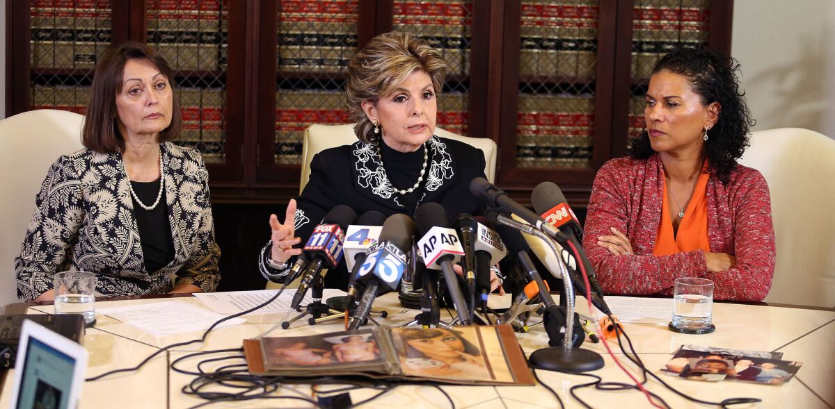 Linda Brown, left, shares her accusations against Bill Cosby in a Feb. 12, 2015 news conference with Attorney Gloria Allred, center, and second alleged victim Lise-Lotte Lublin in Los Angeles.