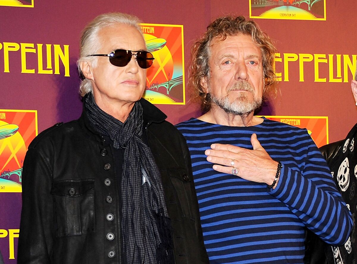 In this Oct. 9, 2012, file photo, Led Zeppelin guitarist Jimmy Page, left, and singer Robert Plant appear at a news conference. A federal judge in Los Angeles ruled Friday, April 8, 2016, that a copyright infringement lawsuit over the song "Stairway to Heaven" should be decided at trial.