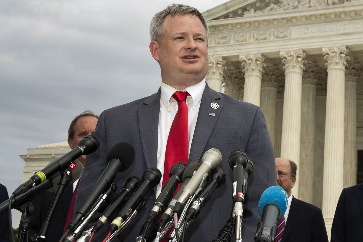 FILE - South Dakota Attorney General Jason Ravnsborg, speaks to reporters in front of the U.S. Supreme Court in Washington on Sept. 9, 2019. Ahead of South Dakota's first-ever impeachment trial next week, state senators are staying silent on how they will vote as they weigh whether to remove Attorney General Jason Ravnsborg for his conduct surrounding a 2020 fatal car crash. (AP Photo/Manuel Balce Ceneta, File)