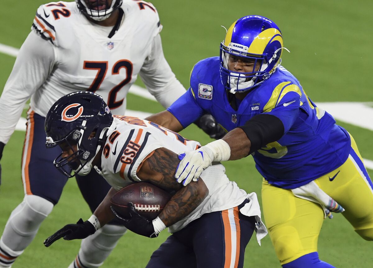 Chicago Bears running back David Montgomery is caught from behind by Rams defensive lineman Aaron Donald.