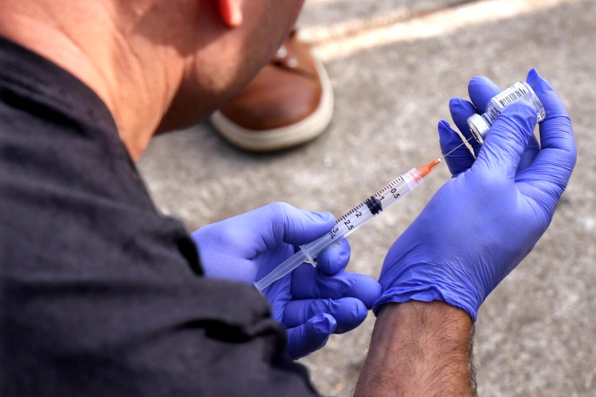 Physician assistant Brett Feldman, with USC Street Medicine, prepares a steroid inject