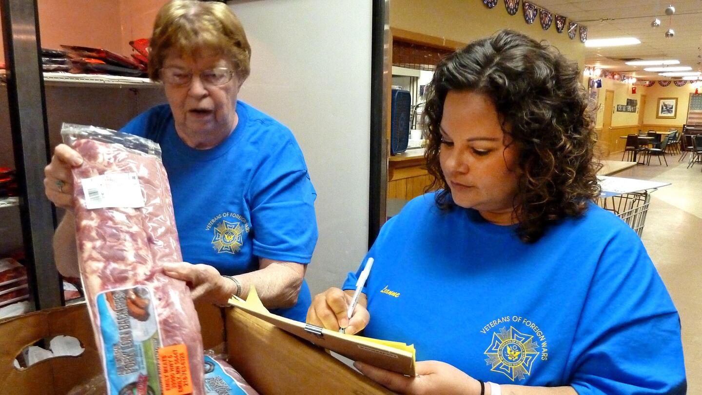 Smith and Philipson inspect a package.