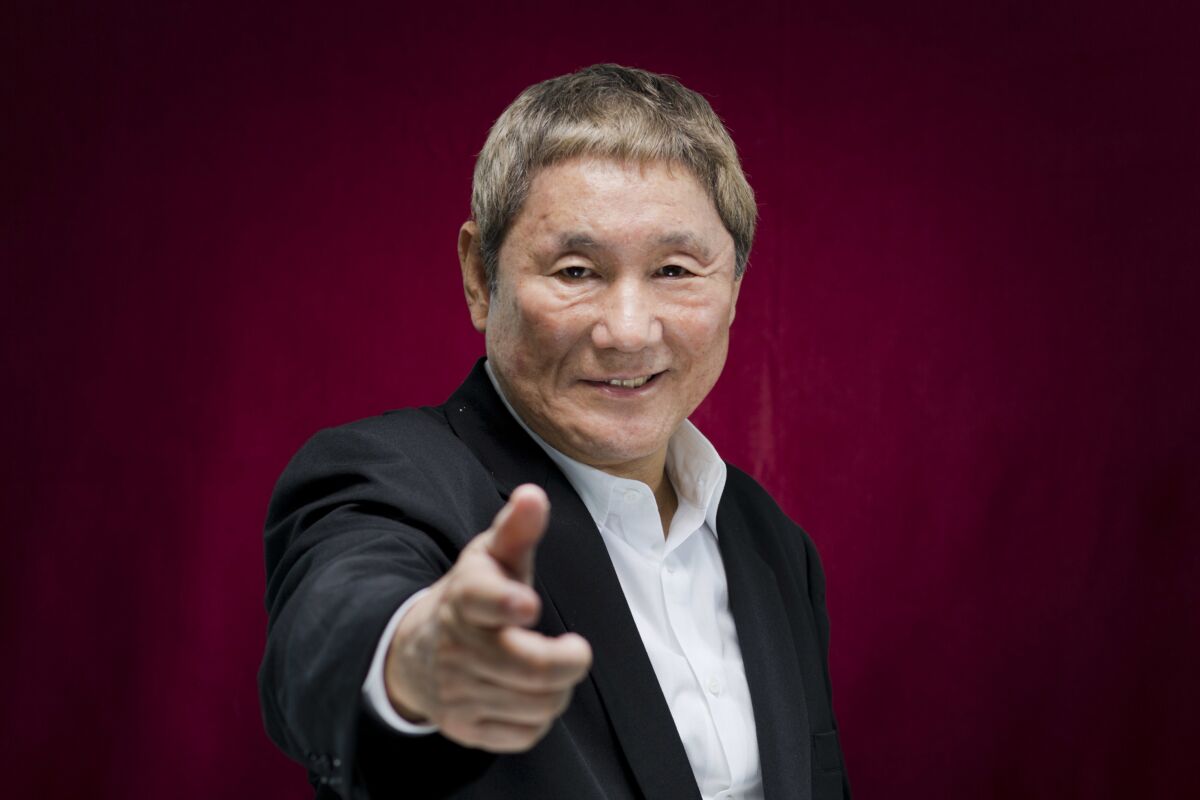 FILE - In this Sept. 8, 2017, file photo, Japanese director Takeshi Kitano poses for portraits for the film "Outrage Coda" at the 74th edition of the Venice Film Festival in Venice, Italy. Police have arrested a man who allegedly attacked with a pickax a car carrying Japan's entertainment icon Kitano, 74, though nobody was injured, according to media reports on Sunday, Sept. 5, 2021. (AP Photo/Domenico Stinellis, File)