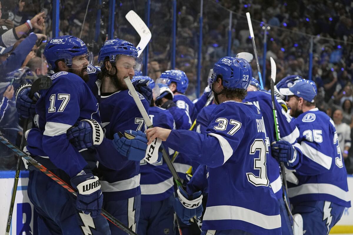 Tampa Bay Lightning players celebrate after beating the New York Islanders in Game 7 on June 25, 2021.