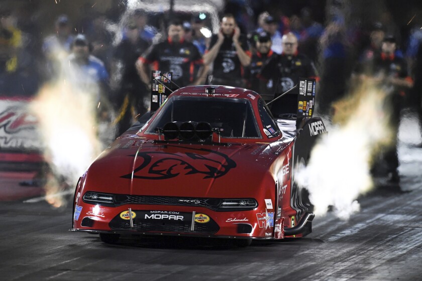 In this photo provided by the NHRA, Matt Hagan takes part in Funny Car qualifying at the Dodge//SRT Mile-High NHRA Nationals drag races Friday, July 16, 2021, at :Bandimere Speedway in Morrison, Colo. (Richard H Shute/NHRA via AP)