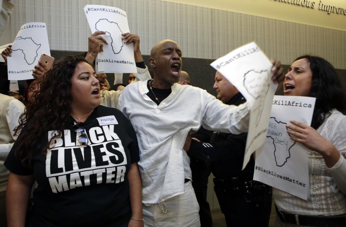 Black Lives Matter protestors disrupt a Los Angeles Board of Police Commissioners meeting in March. (Irfan Khan / Los Angeles Times)