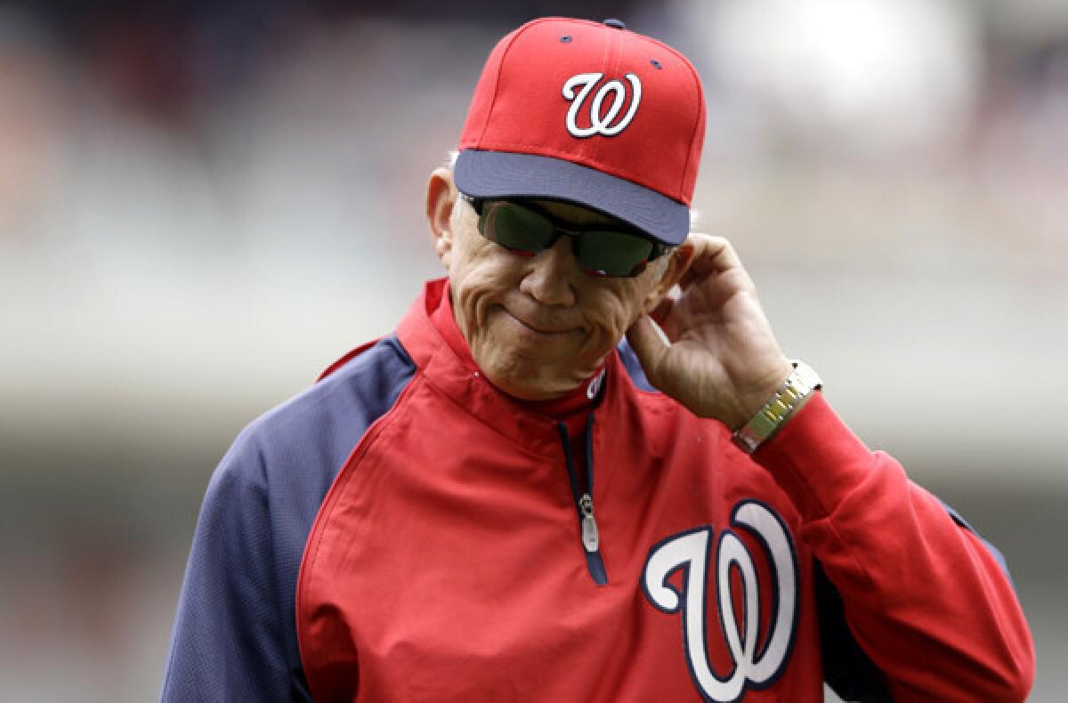 Nationals Manager Davey Johnson walks back to the dougout after pulling starting pitcher Ross Detwiler during a game against the Rockies in Washington.
