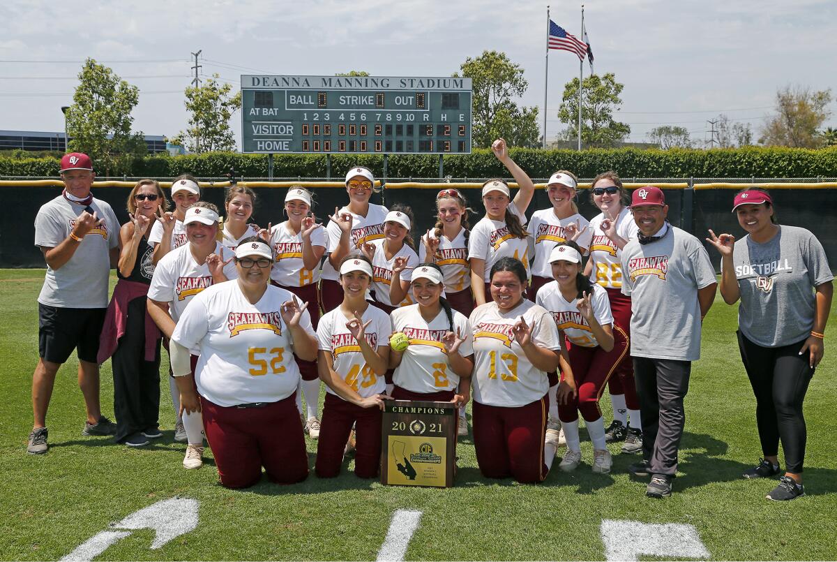 The Ocean View softball team poses with the championship plaque after defeating Upland Western Christian.