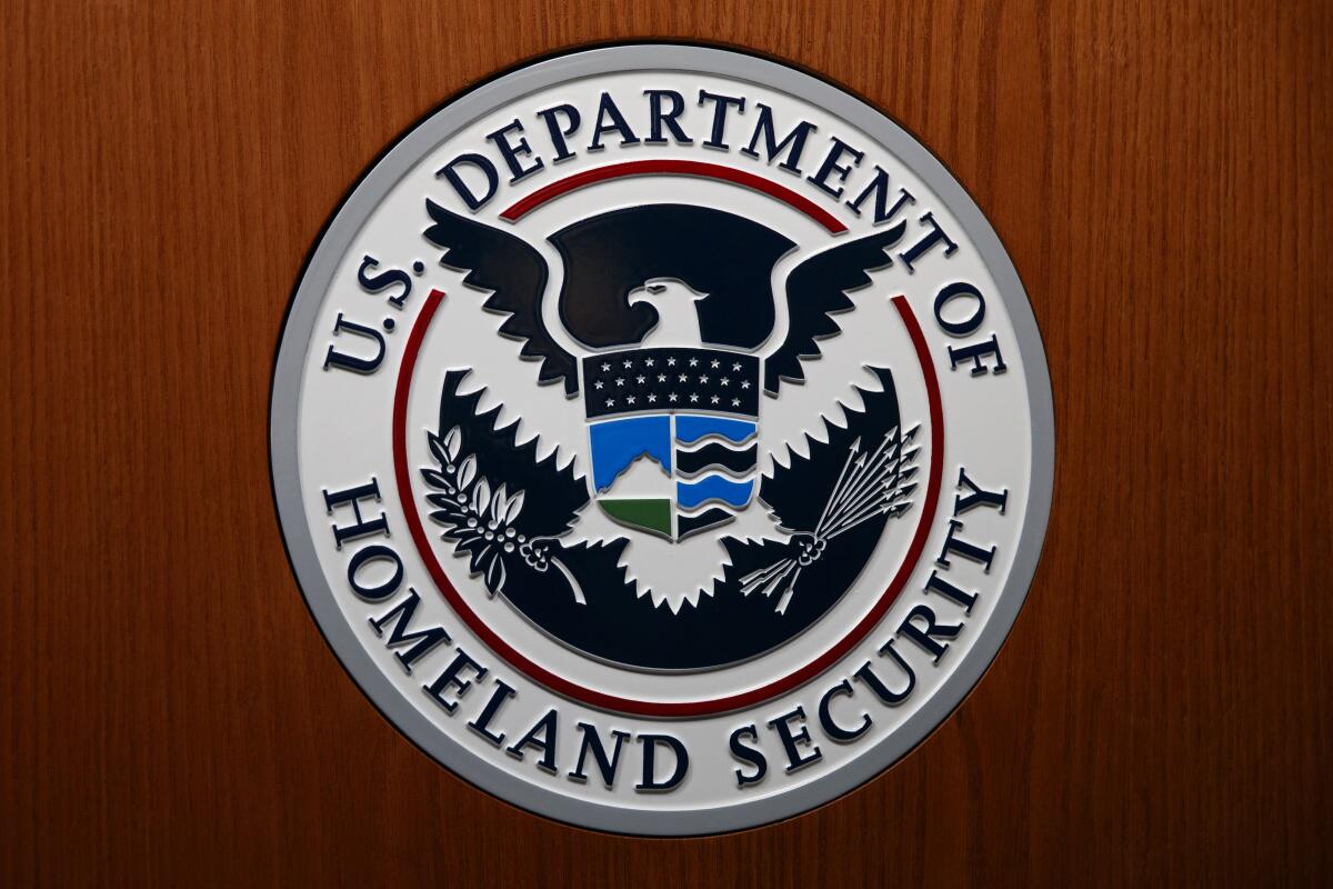 Department of Homeland Security seal is seen during a news conference in Washington in 2019.