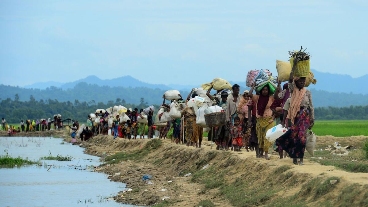 Rohingya refugees on the move near the Bangladesh and Myanmar border in October.