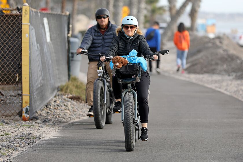 DANA POINT, CA - JANUARY 12: Electric bike (e-bike) riders along a trail at Doheny State Beach on Thursday, Jan. 12, 2023 in Dana Point, CA. Orange County cities attempting to regulate electric bikes (e-bikes) with varying degrees of success. (Gary Coronado / Los Angeles Times)