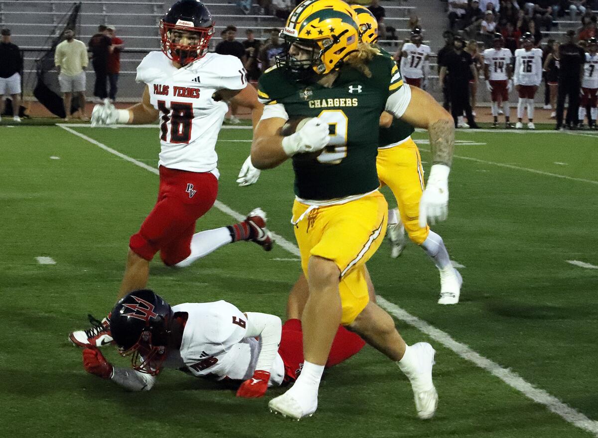 Edison's Julius Gillick (9) runs close to the goal line against Palos Verdes in a nonleague game at Huntington Beach.