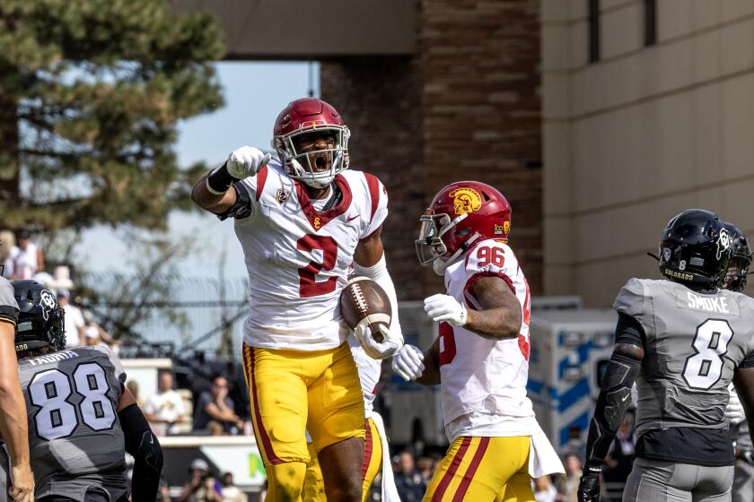 USC defensive end Romello Height celebrates after recovering a blocked punt against Colorado 