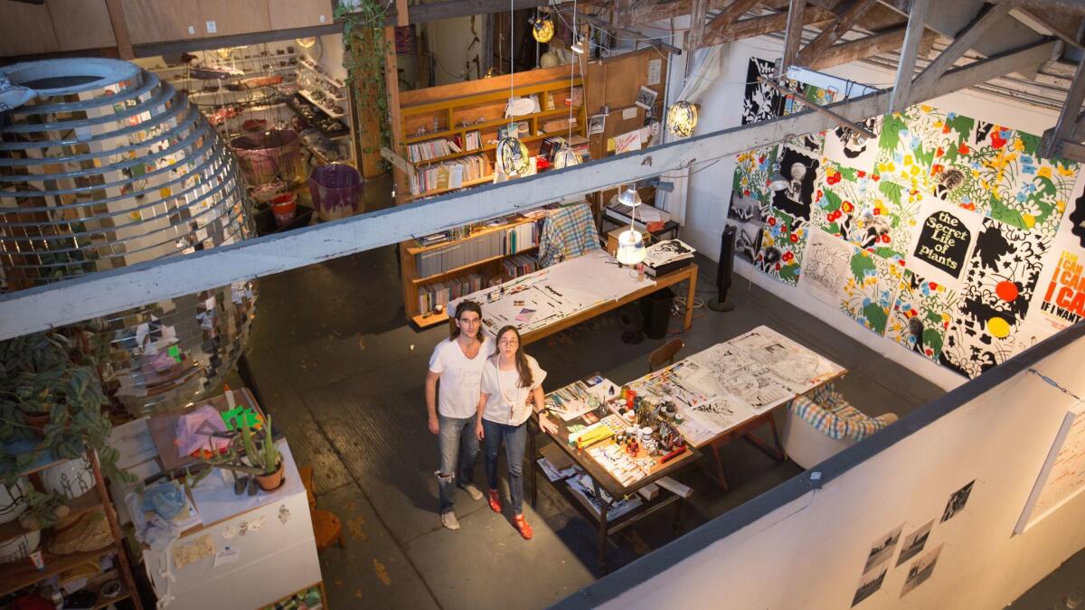 Artists Michael Parker and Alyse Emdur at their Artists' Loft Museum, a show in their studio loft that brings together the work of artists who have passed through their space.