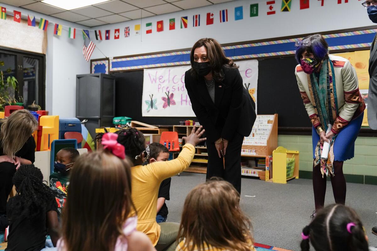 Vice President Kamala Harris and Rep. Rosa DeLauro talk with children at a child-development center in West Haven, Conn.