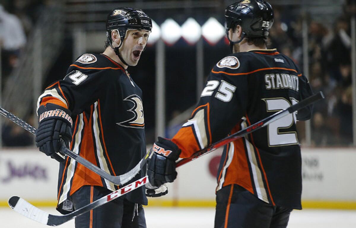 Ducks defenseman Sheldon Souray (44) celebrates with teammate Brad Staubitz after scoring a goal against the Flames earlier this month at the Honda Center.