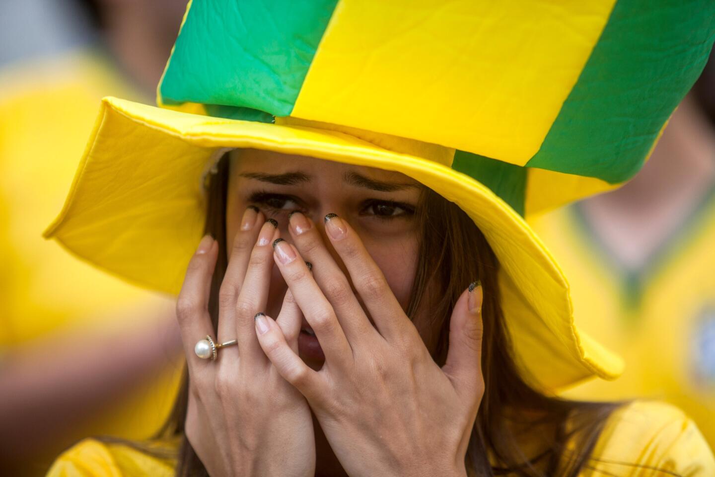 Fans watch the Round of 16 match between Brazil and Chile.