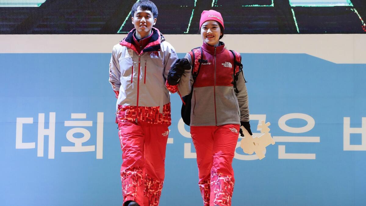 Volunteers wear the uniforms of the Pyeongchang 2018 Olympics on Nov. 6, 2017, in Seoul.