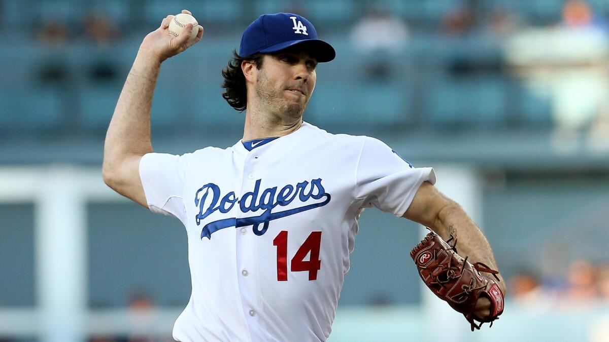 Dodgers starter Dan Haren delivers a pitch during Monday's game against the Cleveland Indians at Dodger Stadium.
