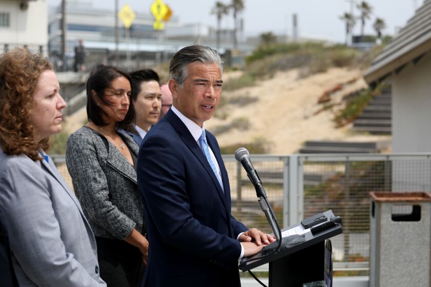 PLAYA DEL REY, CA - APRIL 28: California Attorney General Rob Bonta, flanked by his legal team, announced Thursday at Dockweiler State Beach that his office has launched an unprecedented investigation into the fossil fuel and petrochemical industries' alleged role in causing and exacerbating the plastic pollution crisis on Thursday, April 28, 2022 in Playa Del Rey, CA. (Gary Coronado / Los Angeles Times)